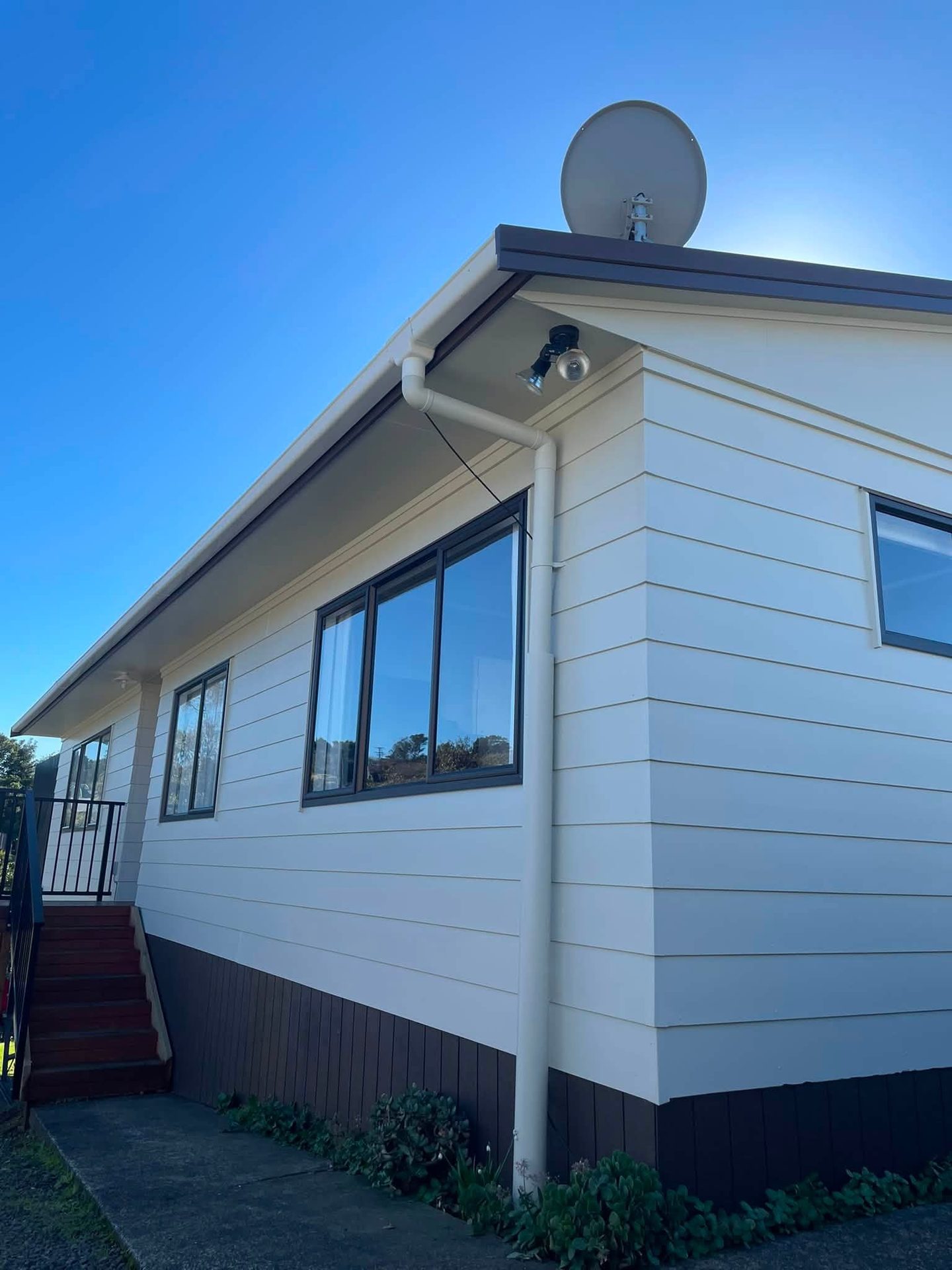 Freshly painted white weatherboard house exterior