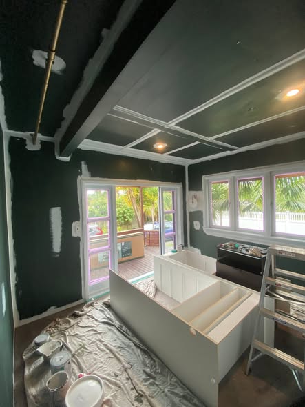 Interior room being repainted with a tidy, protected finish