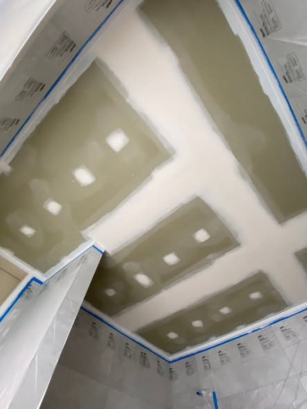 Ceiling masked and prepped for a smooth trim finish