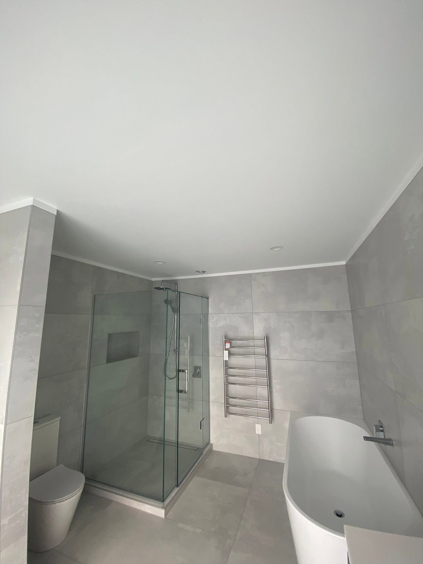 Tiled bathroom with a clean painted finish